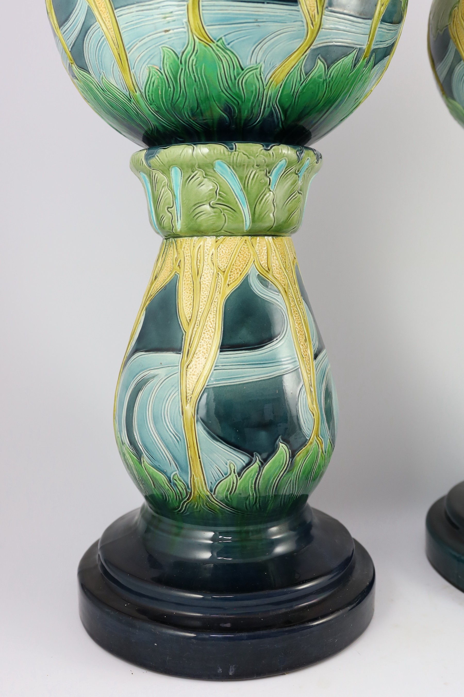 A pair of Burmantofts Art Nouveau faience jardinieres on matching pedestals, c.1900, total height 69cm, diameter 32cm, minor faults